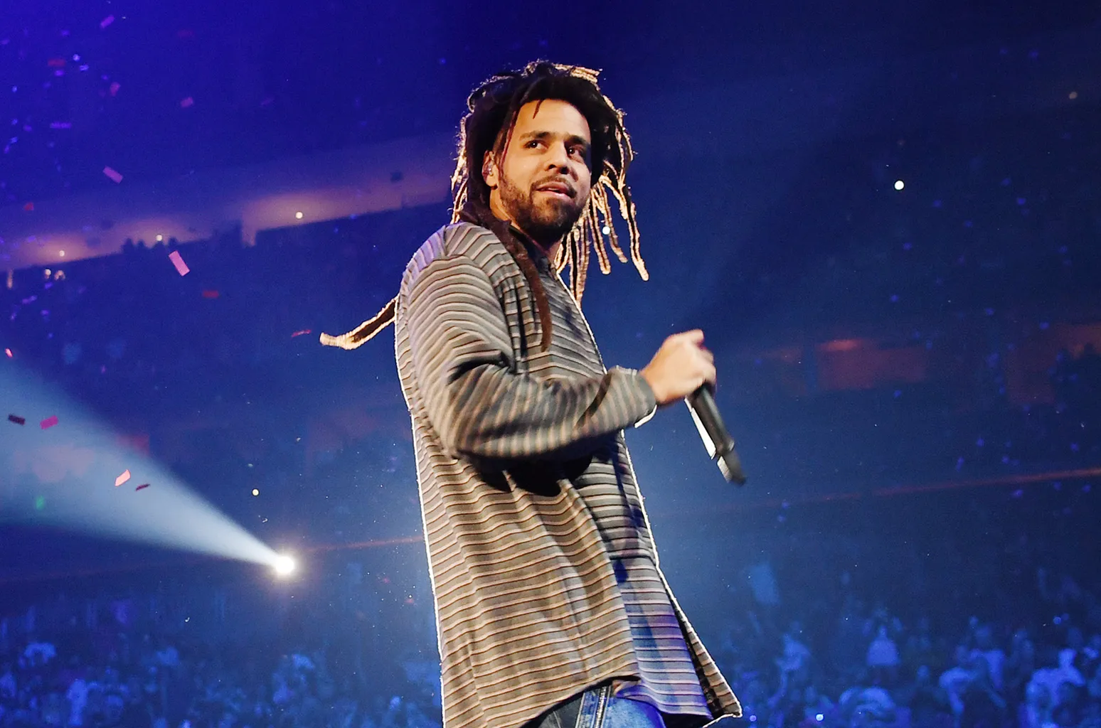 J. Cole silhouette on stage